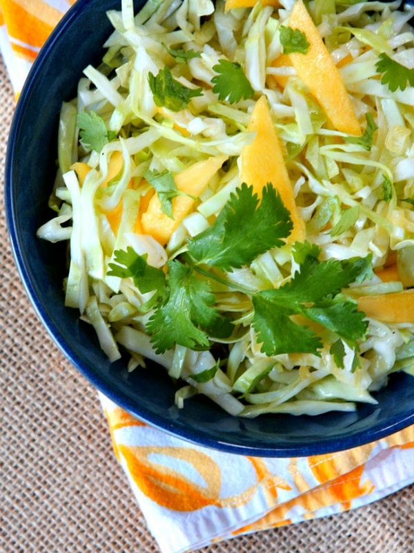 mango slaw in a blue bowl