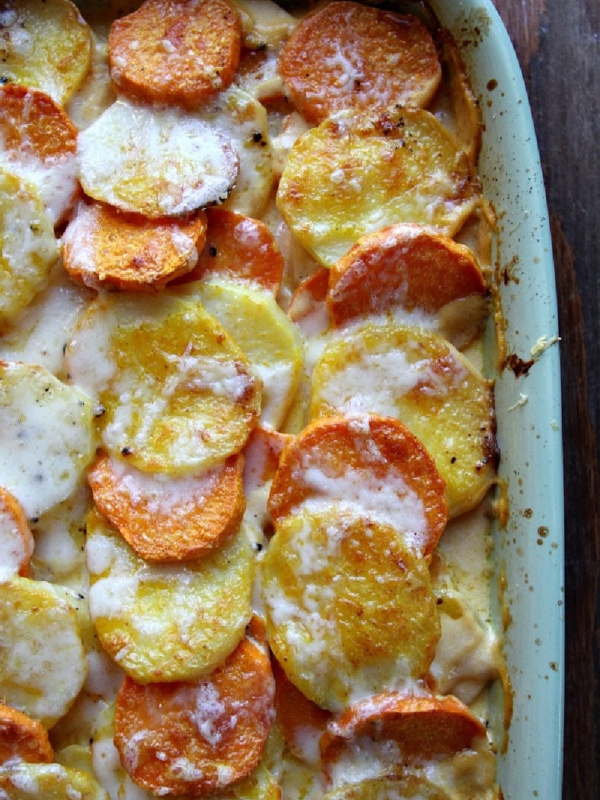 pumpkin scalloped potatoes in a casserole dish