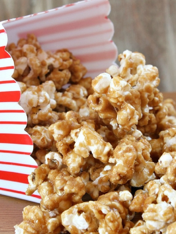 peanut butter caramel corn in a red and white popcorn box