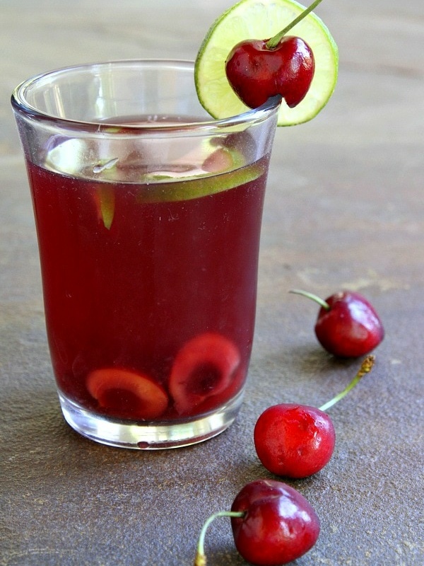 glass of cherry limeade sangria