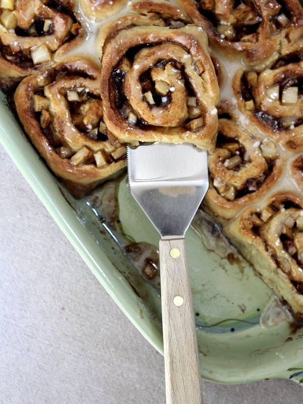 no yeast apple cinnamon rolls in green dish with spatula