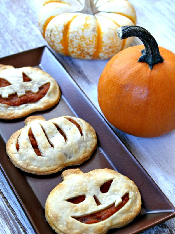 pumpkin pie pop tarts on a tray with pumpkins in background