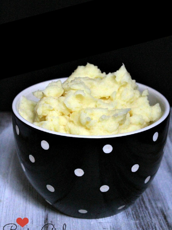 perfect mashed potatoes in a black and white bowl