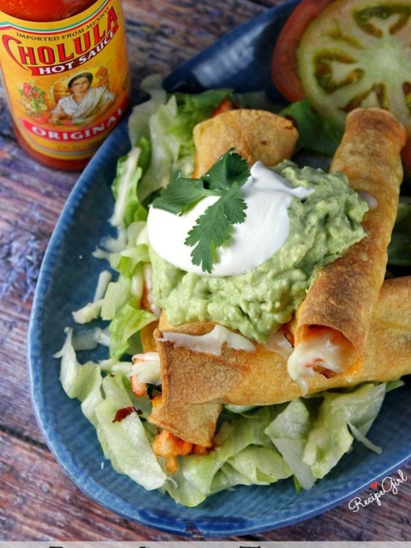 baked salmon taquitos on a plate