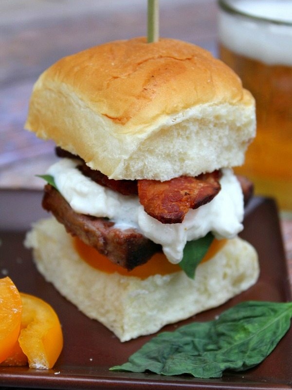 filet mignon caprese slider skewered with a sandwich pick. Beer on the side.