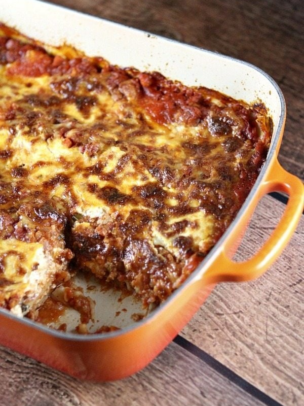 lasagna in a pan with a piece cut out