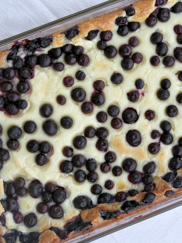 overhead shot of blueberry gooey butter cake in a 9x13-inch pyrex pan