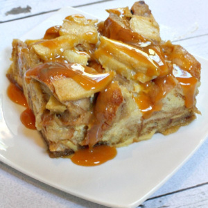 slice of caramel apple bagel bread pudding on white plate