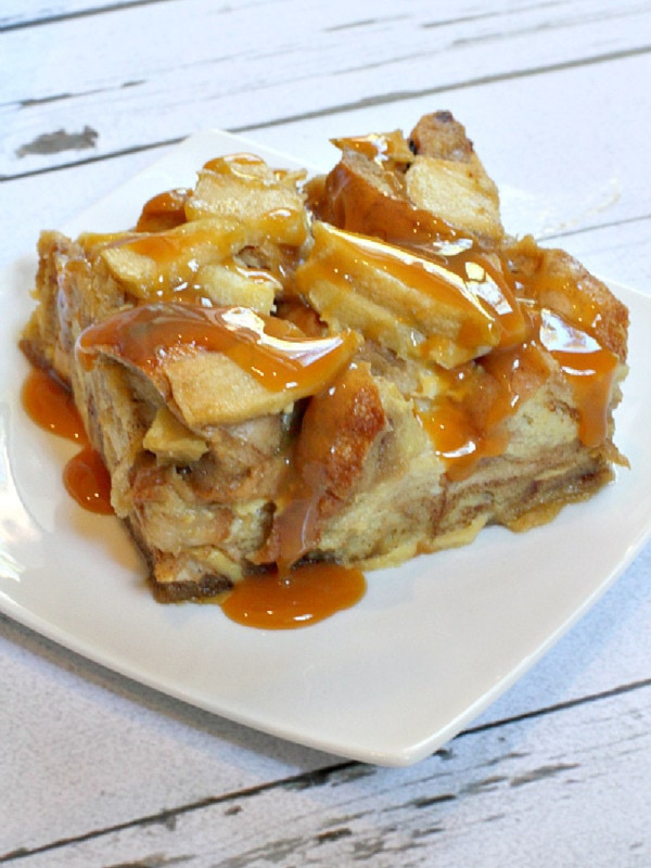 slice of caramel apple bagel bread pudding on white plate