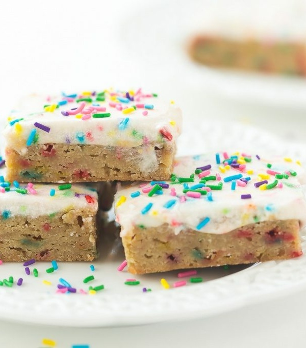 These Funfetti Frosted Blondies are dense, chewy and full of sprinkles! They're perfect for kids lunch boxes or a simple celebration!