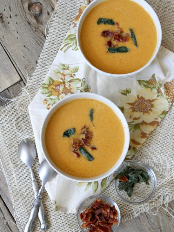 two bowls of sweet potato soup