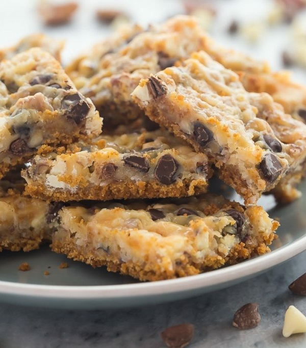 These Seven Layer Bars have a graham cracker crust and are piled with nuts, coconut, chocolate chips and white chocolate chips! They are totally decadent!