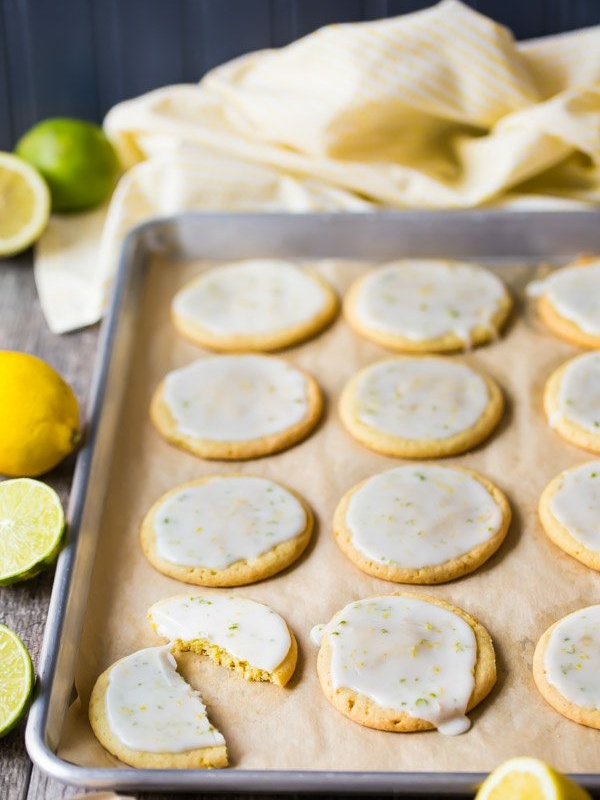 iced lemon lime cookies on a baking sheet