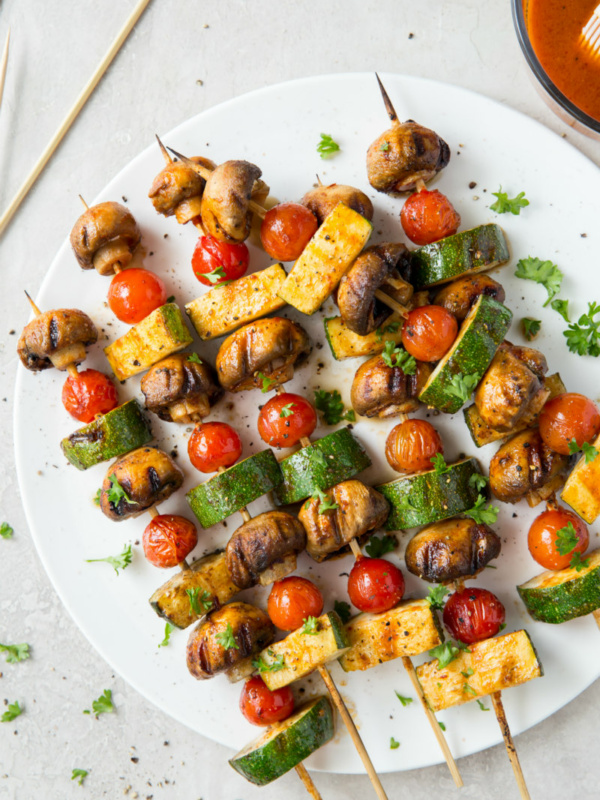 chipotle glazed vegetable kabobs on a white plate