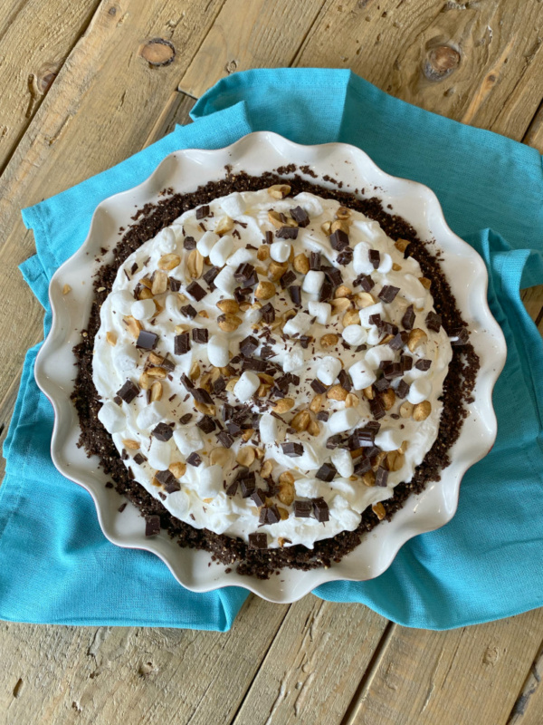 overhead shot of rocky road pie sitting on a teal blue napkin