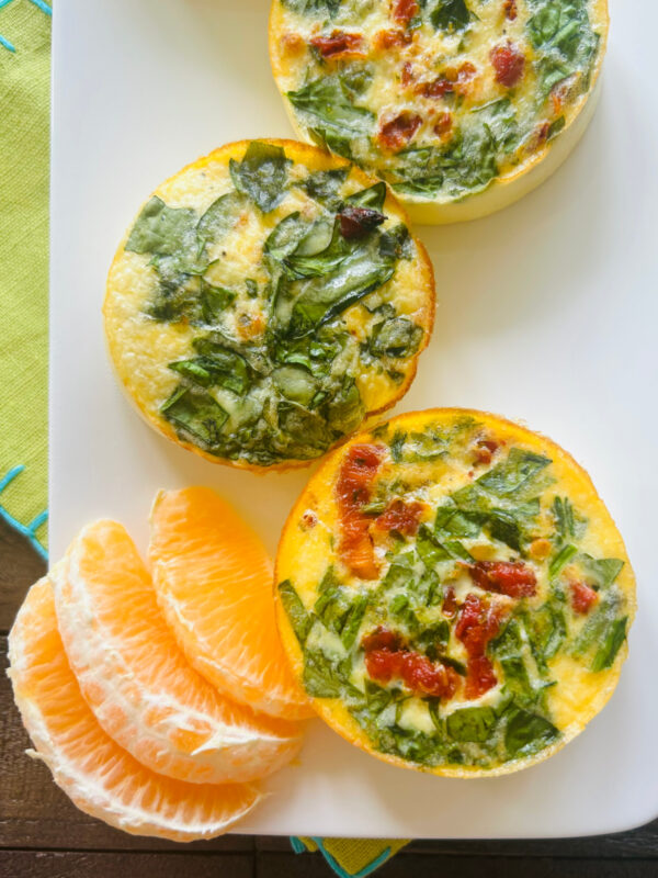 overhead shot of copycat starbucks egg bites on plate with orange segments