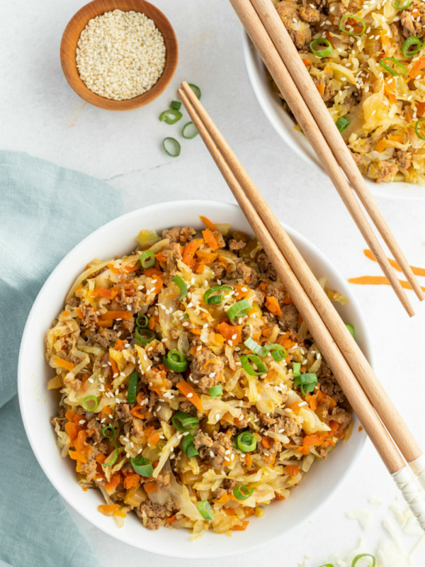 egg roll in a bowl with chopsticks on top