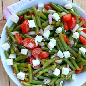 green bean salad in a white bowl