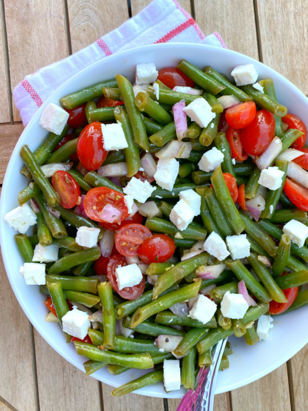 green bean salad in a white bowl