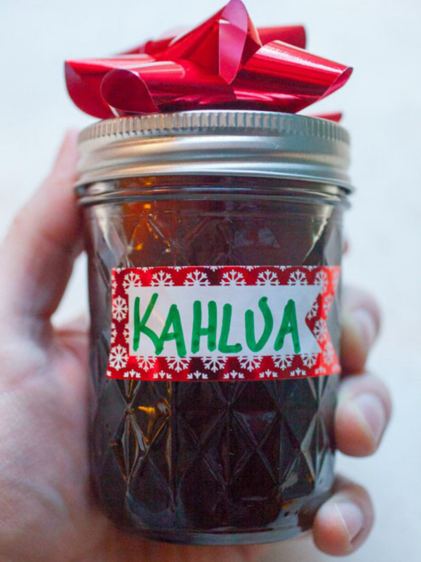 homemade kahlua in a jar with a red bow