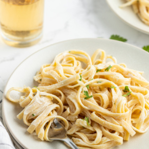 serving of fettuccine alfredo on a white plate