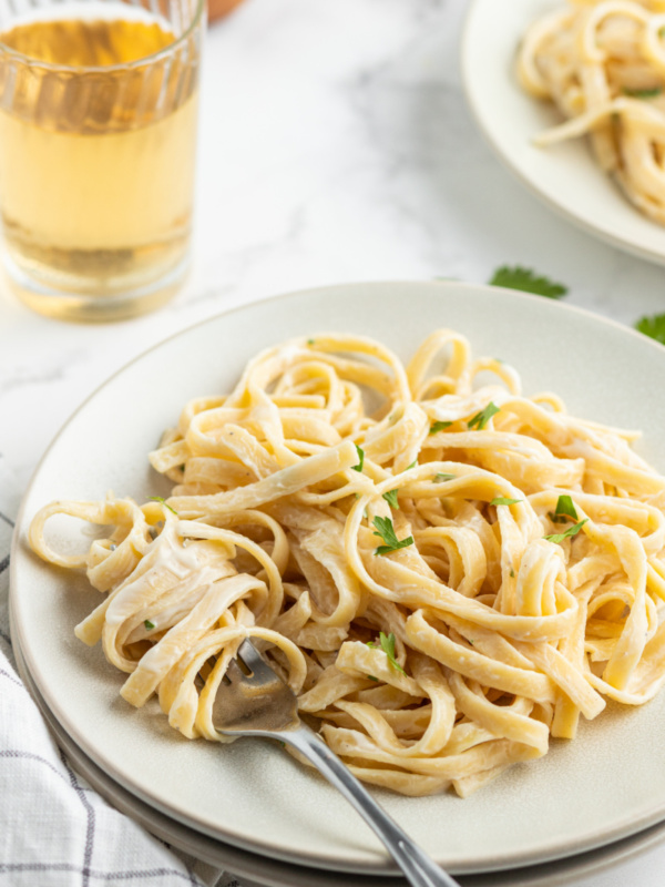 serving of fettuccine alfredo on a white plate