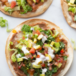 tortilla topped with toppings to make tostada