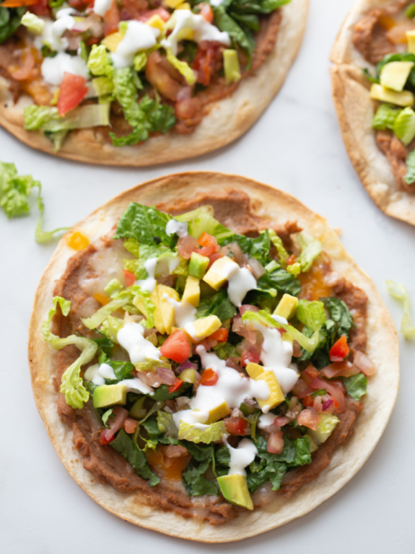 tortilla topped with toppings to make tostada