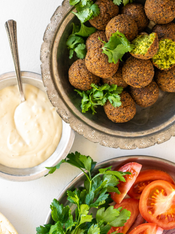 falafel in bowl and tahini sauce and fresh veggies