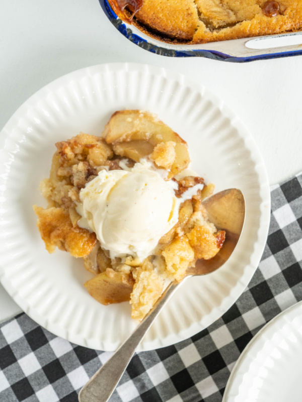 serving of apple cobbler with ice cream on top