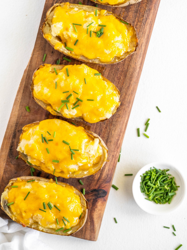 twice baked potatoes on a serving platter