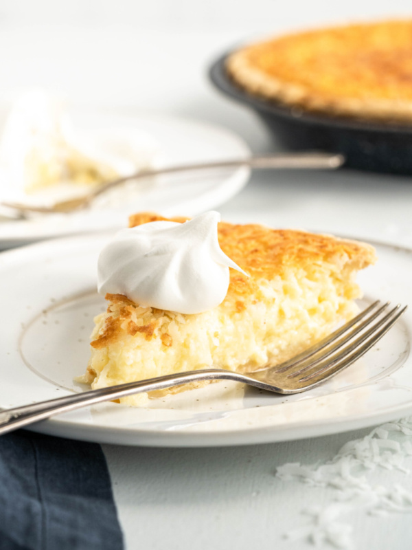 slice of coconut custard pie on a plate