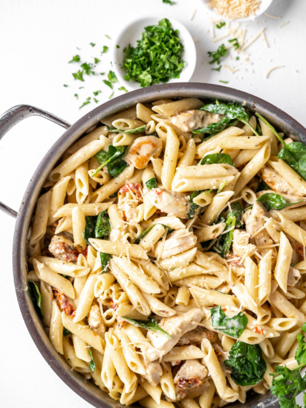 tuscan chicken pasta in a skillet