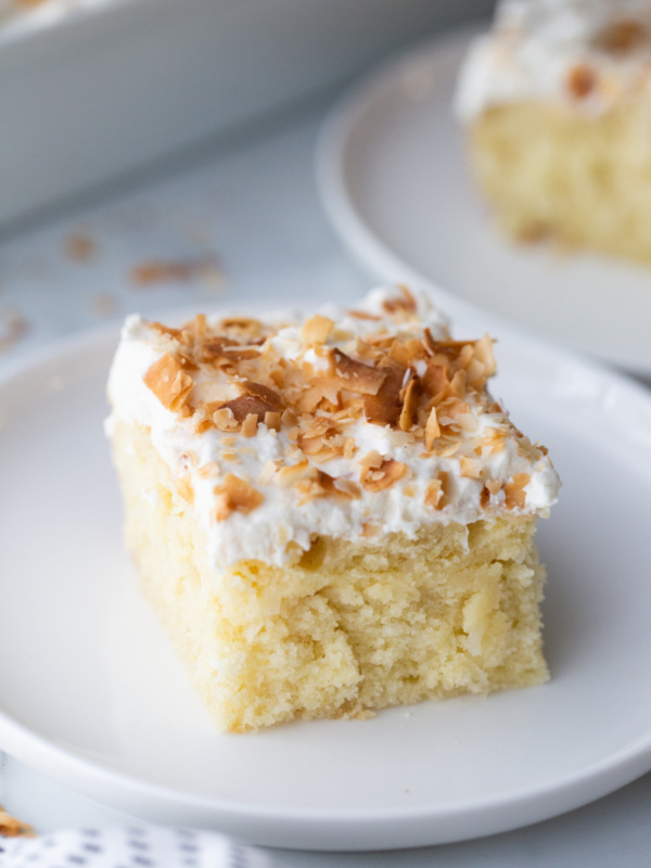 slice of coconut cake on plate