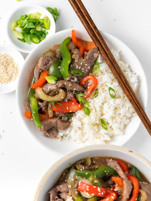 pepper steak served in bowl with rice