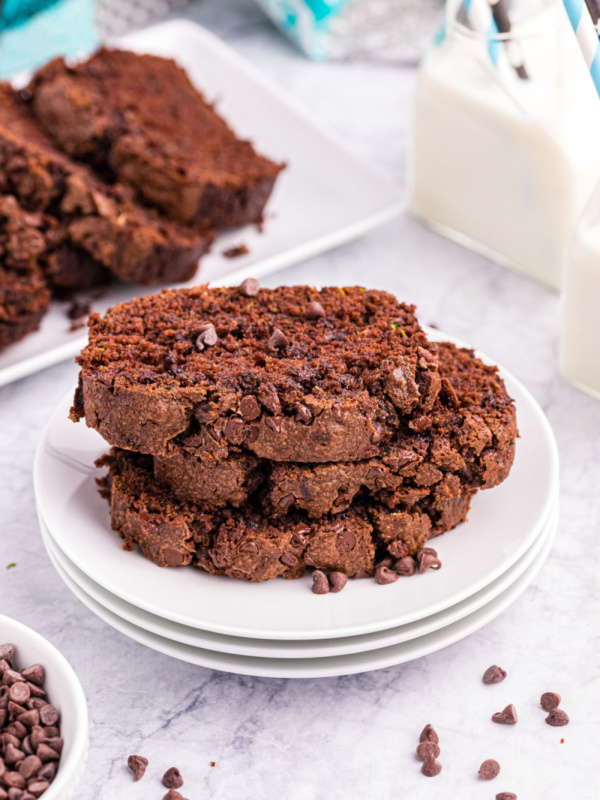 three slices of chocolate zucchini bread on a plate