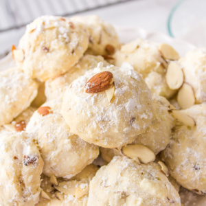 almond cream cheese snowball cookies displayed on a platter