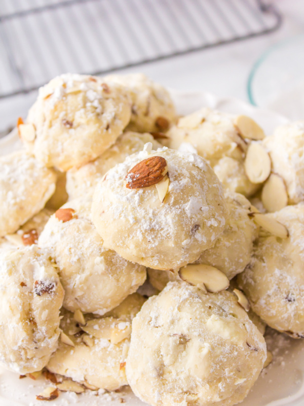 almond cream cheese snowball cookies displayed on a platter