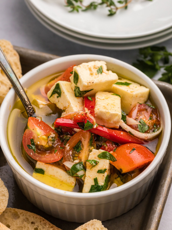 bowl of marinated feta with cherry tomatoes