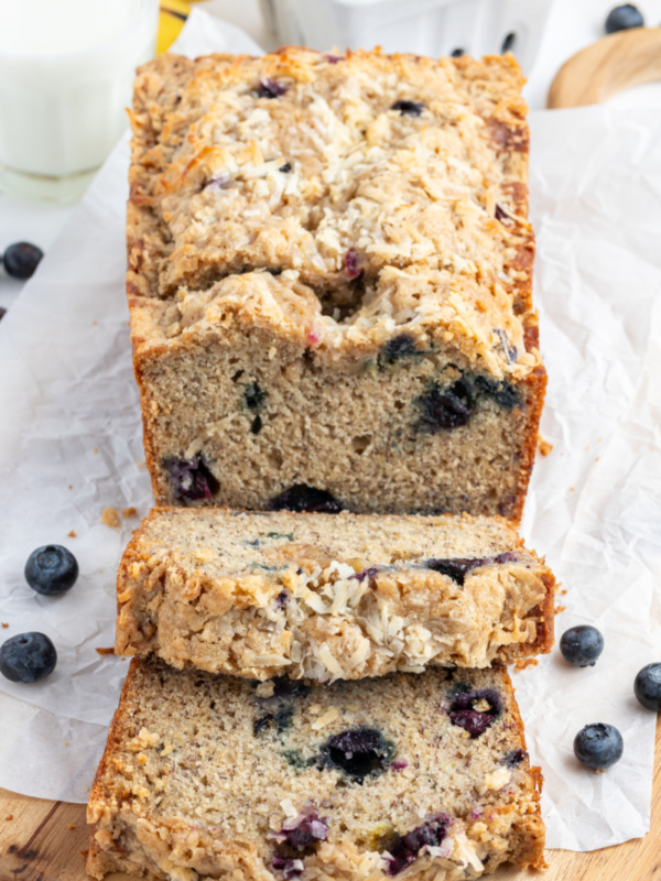 loaf of blueberry coconut banana bread cut into slices