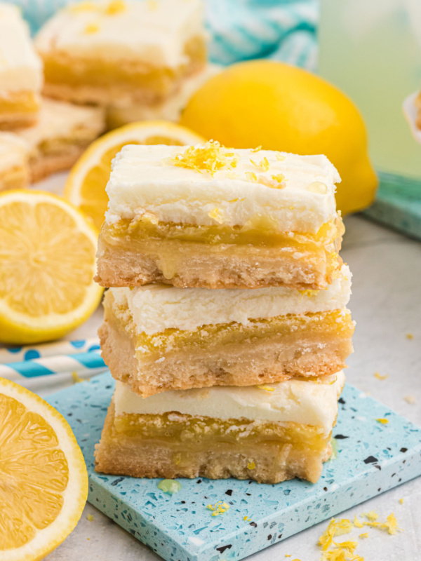 three frosted lemon bars stacked