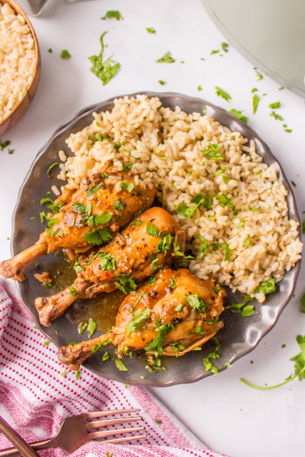 coconut chicken drumsticks on a plate with rice