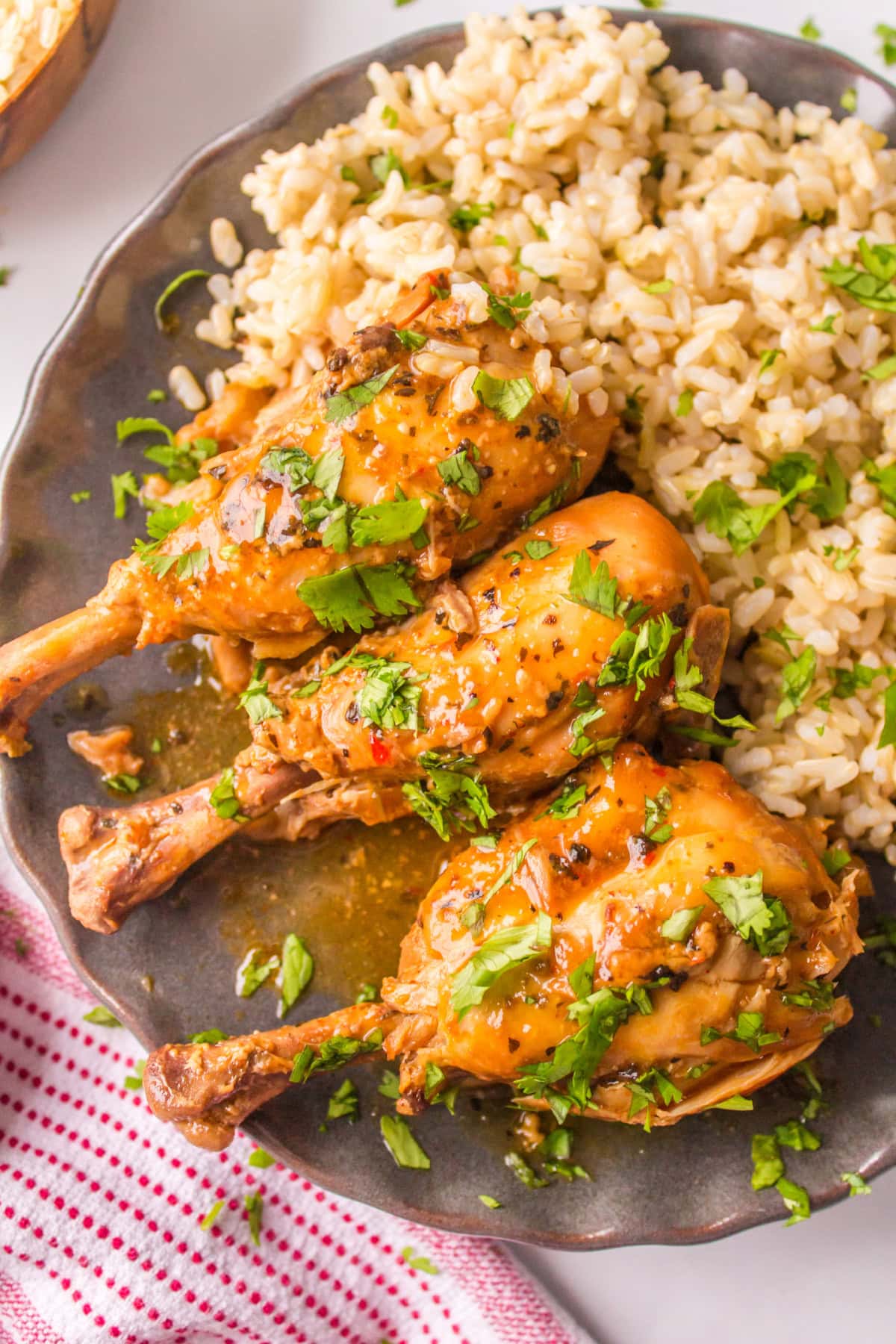 close up coconut chicken drumsticks on plate