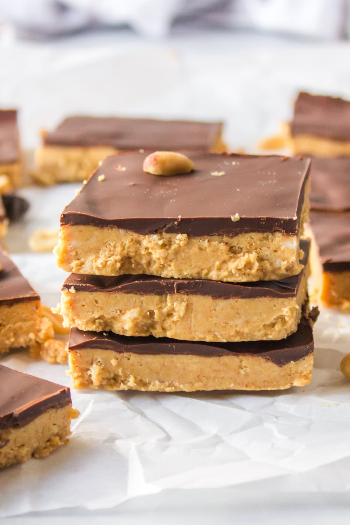 three no bake peanut butter bars stacked