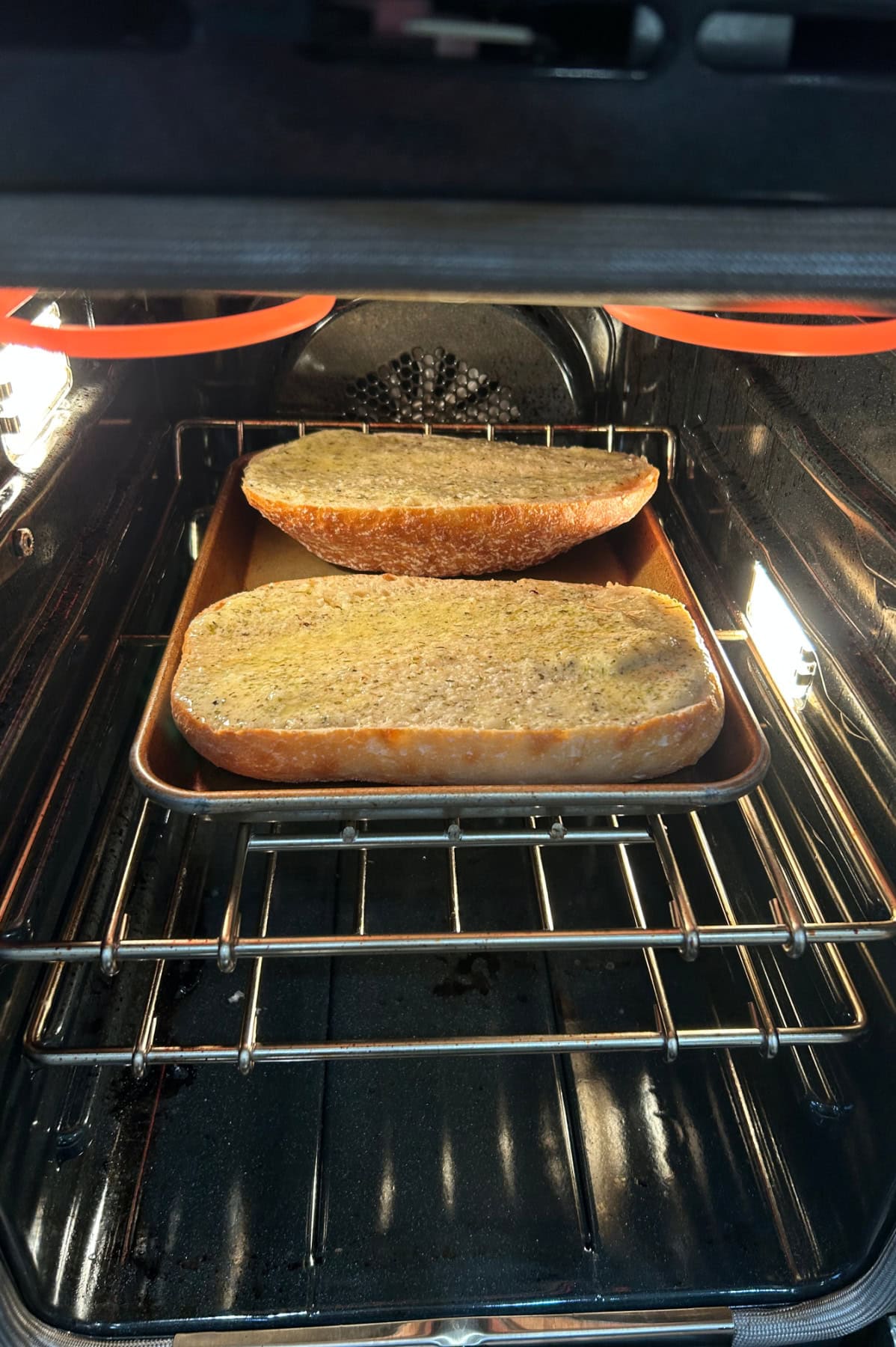 garlic bread broiling in oven