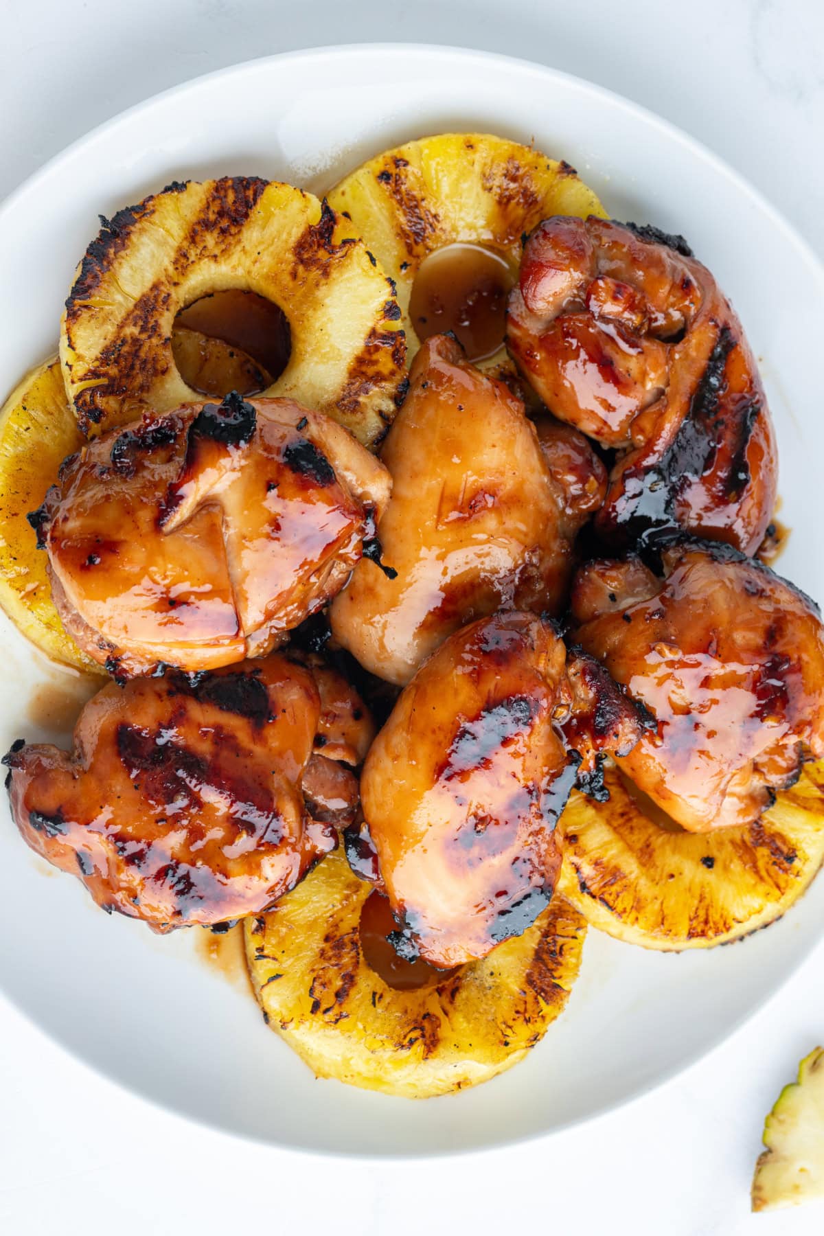 grilled huli huli chicken with pineapple on plate