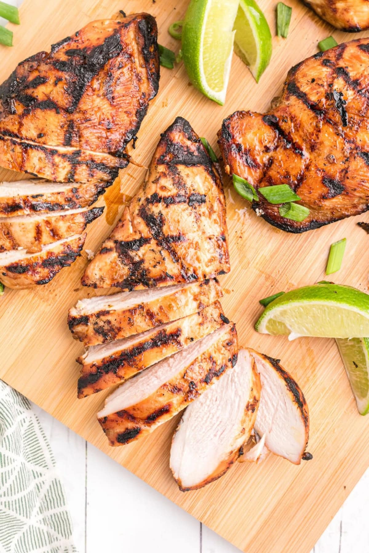 hoisin and lime marinated chicken sliced on board