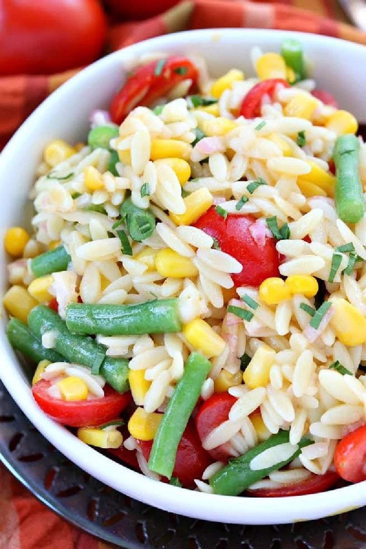 orzo salad with corn green beans and tomatoes in bowl