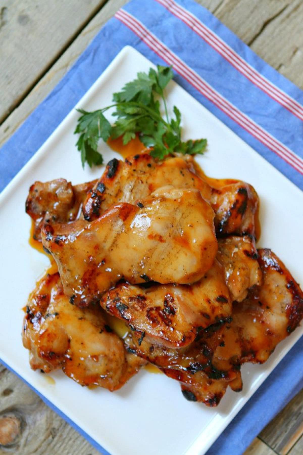 plum glazed grilled chicken thighs on plate