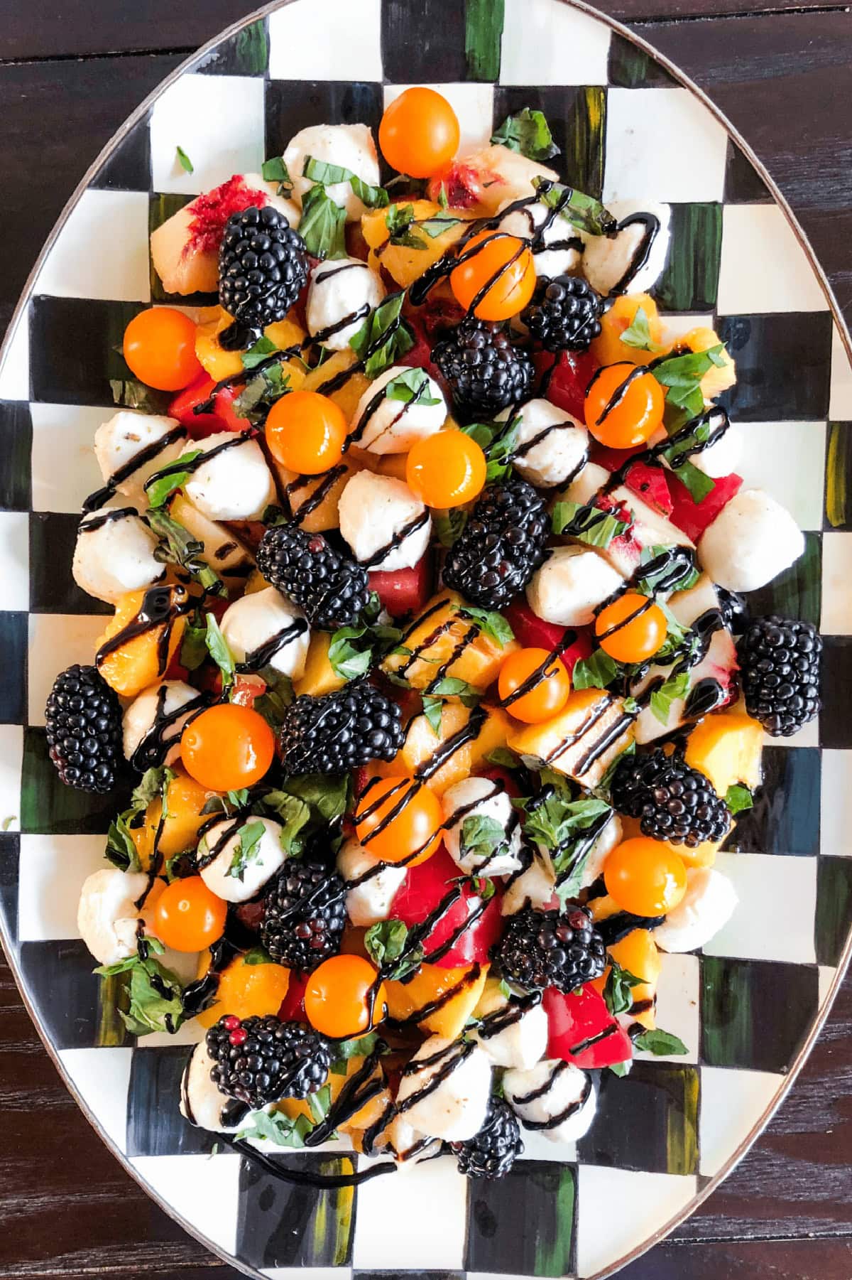 platter of summer fruit caprese salad